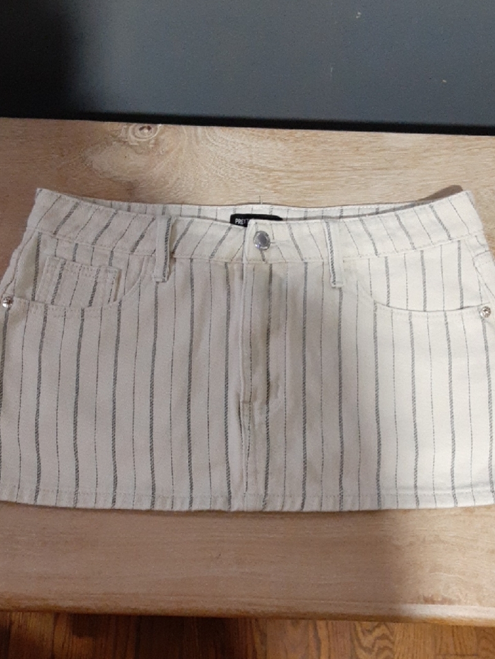 PrettyLittleThing Cream Mini Skirt with Black Pinstripes